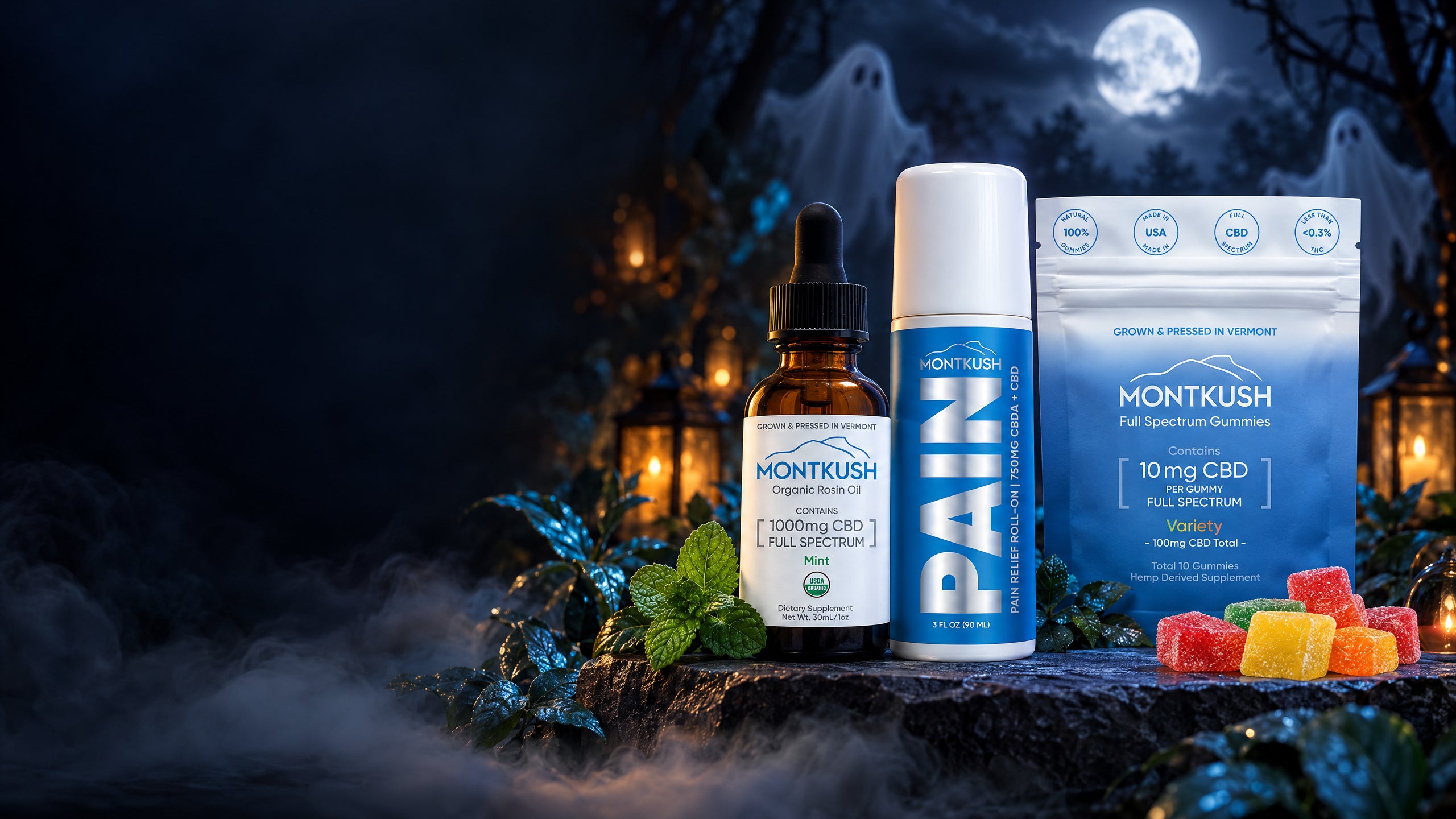MONTKUSH BOOGO Kit with Mint CBD Oil Drops, CBD Pain Relief Roll-On, and Pure Full Spectrum CBD Gummies in a Halloween setting